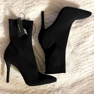 Black high heeled booties- never worn